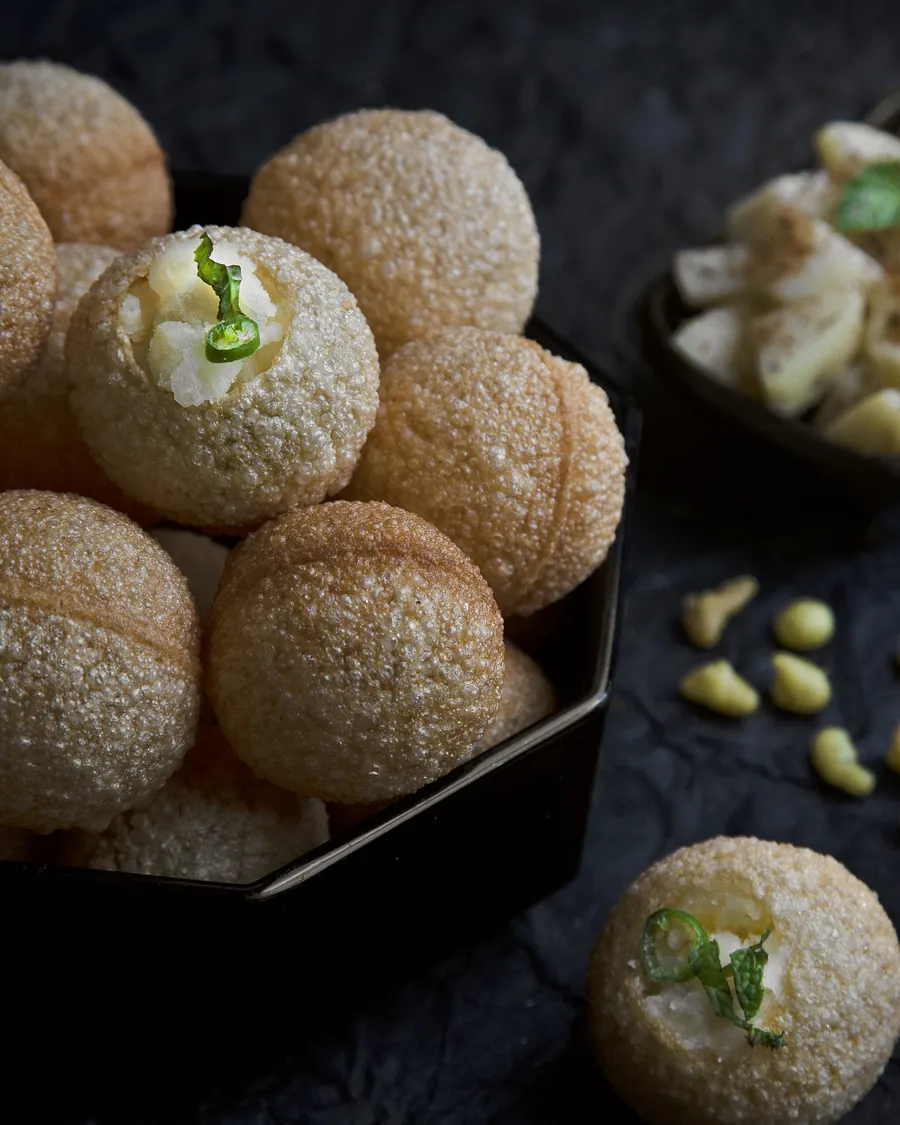 Crisp fuchka shells with tamarind water