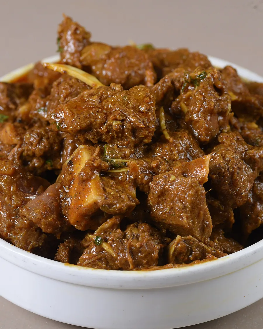 Dark slow cooked beef kala bhuna in a bowl