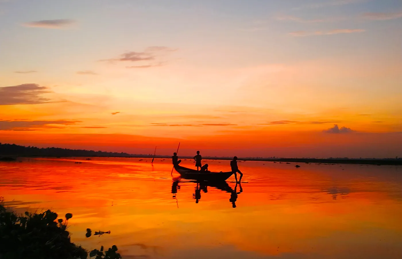 Sunset over the Padma with fishing boats
