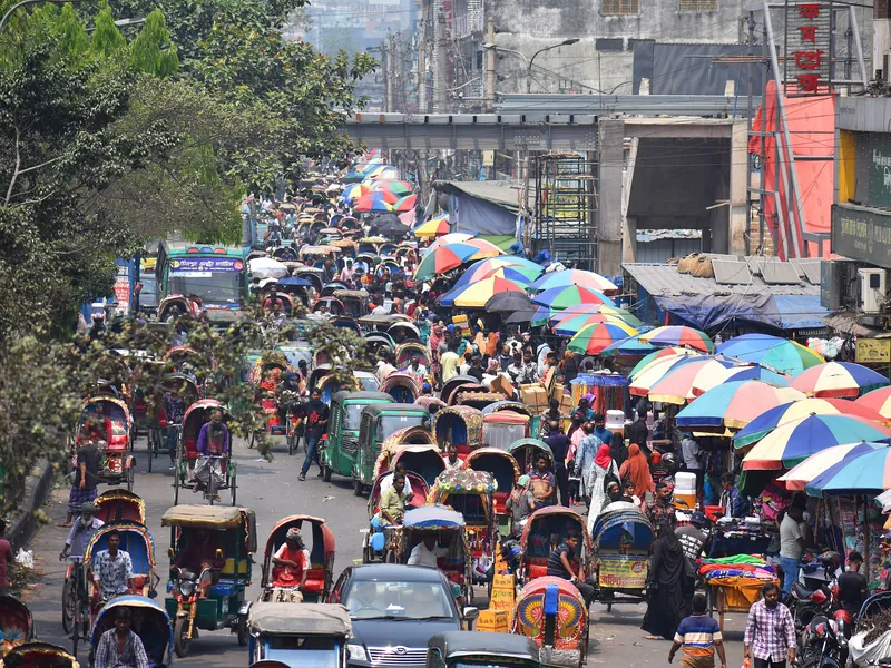 Painted rickshaws in Dhaka traffic