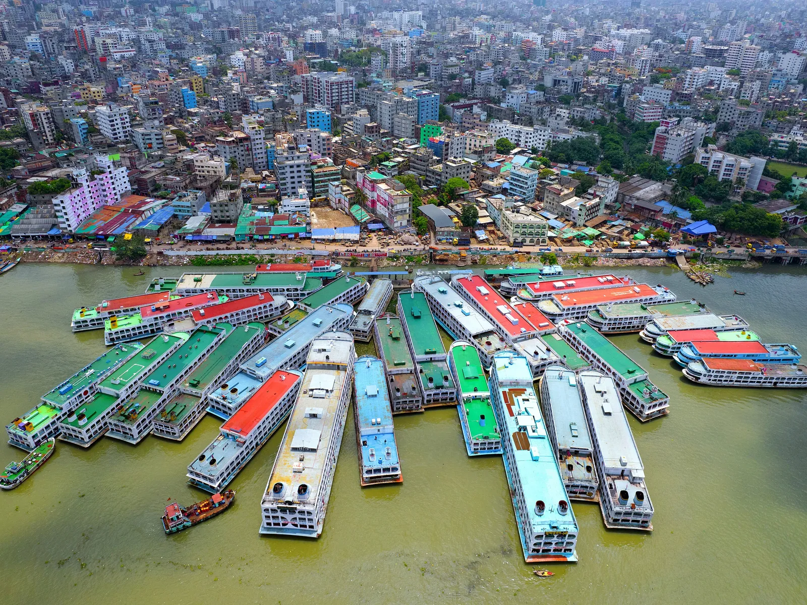 Aerial view of passenger launches crowded along the river at Dhaka