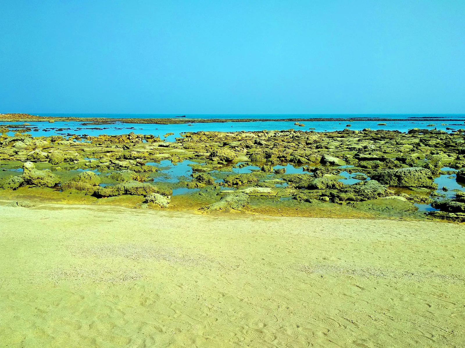 Turquoise water over the coral shelf at Saint Martin's Island